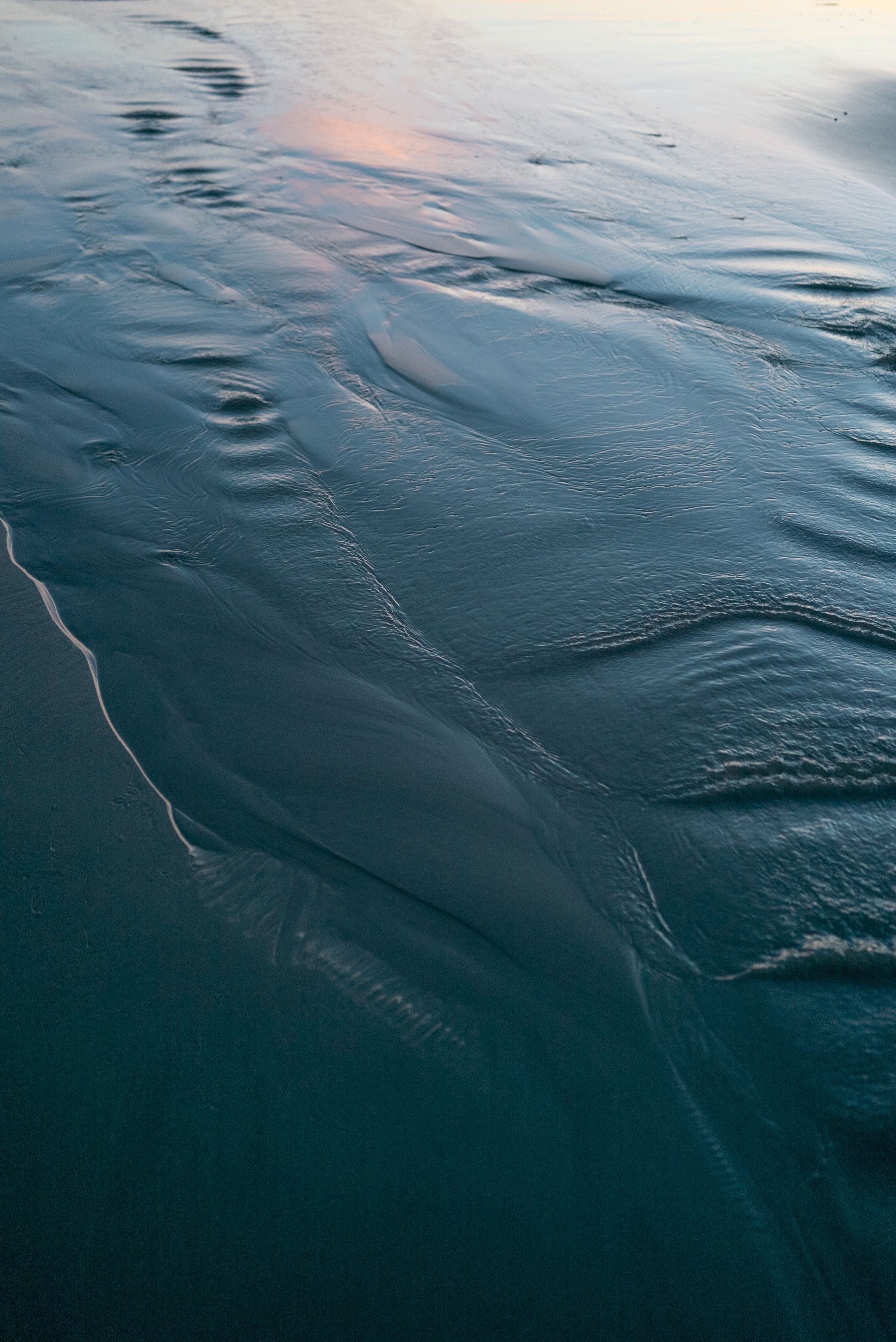 Soft ripples across a blue water surface